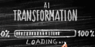 An image showing a blackboard with AI Transformation written on it in white chalk and a loading bar showing progress from 0% to 100%