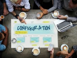 Overhead view of employees around a Configuration design chart - setting up WordPress