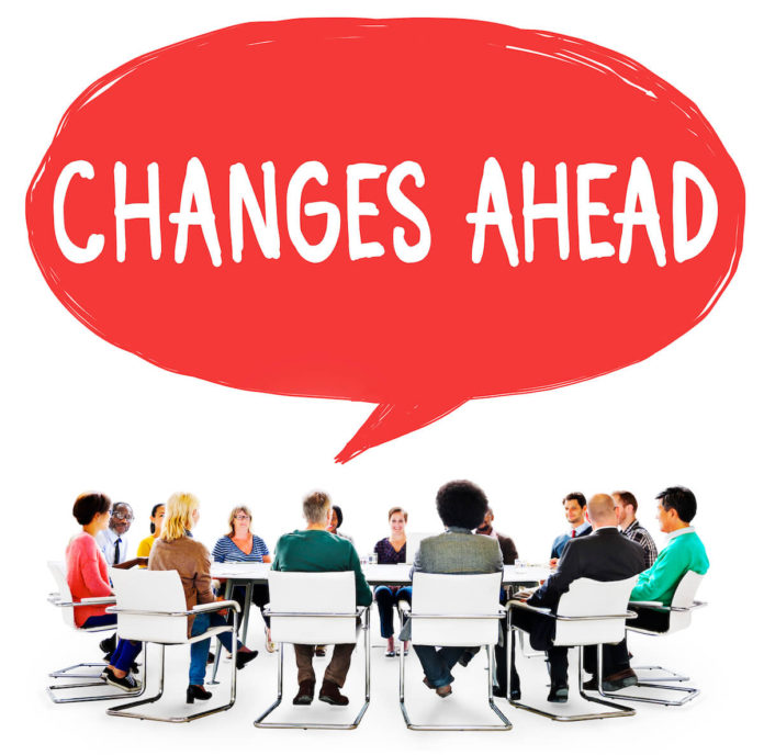 Overcome Your Fear Of Change - Feature Round table of people with a callout "Changes Ahead" - Overcome Your Fear Of Change