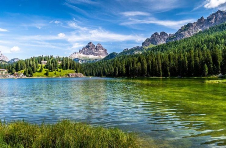 Gorgeous stock photo of river bordered by a mountain chain